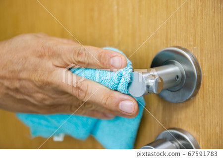 Prevention cleaning Door handles by Disinfectant solution for killing corona virus on touching surfaces, concept coronavirus COVID19 67591783
