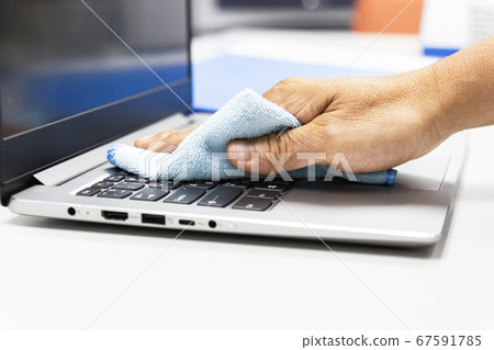 Concept Prevention cleaning frequently, Focus on the high traffic areas that enable pathogens to spread around the computer equipment such as keyboards of laptop computer 67591785