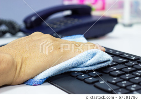 Concept Prevention cleaning frequently, Focus on the high traffic areas that enable pathogens to spread around the computer equipment such as keyboards of laptop computer Concept Prevention cleaning frequently, Focus on the high traffic areas that enable pathogens to spread around the computer equipment such as keyboards of laptop computer 67591786