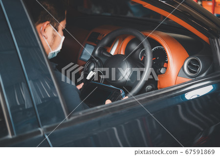 Checking a car engine OBD for repair at car garage Checking a car engine OBD for repair at car garage 67591869