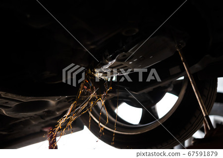 Car mechanic drain automatic transmission fluid Car mechanic drain automatic transmission fluid 67591879