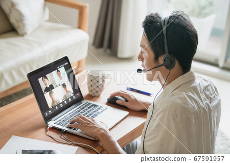 Image of a Japanese man working remotely at home or working from home 67591957