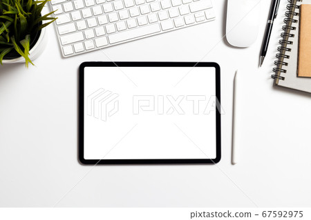 Top View office desk with mockup empty screen tablet and office supplies with copy space Top View office desk with mockup empty screen tablet and office supplies with copy space 67592975