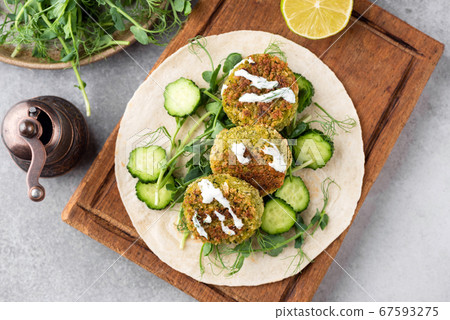 Falafel with sauce on tortilla bread Falafel with sauce on tortilla bread 67593275
