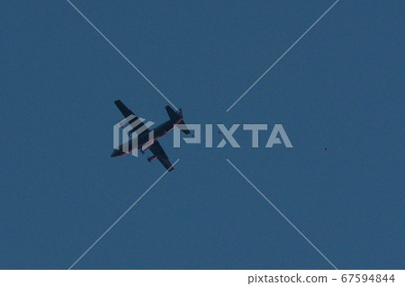 Parachute troops descending from C-130 in the evening Parachute troops descending from C-130 in the evening 67594844