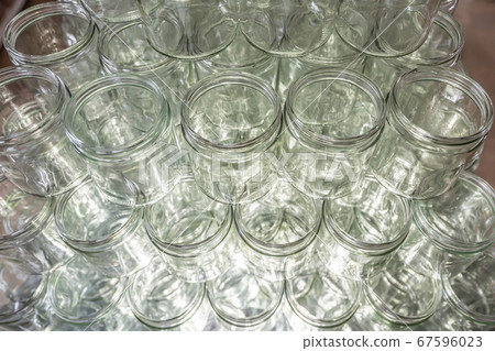 many glass jar empty glasses row for jam honey with lid caps abstract background bokeh many glass jar empty glasses row for jam honey with lid caps abstract background bokeh 67596023