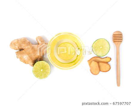 Healthy herbal drink in mug or tea with lemon and ginger Healthy herbal drink in mug or tea with lemon and ginger 67597707