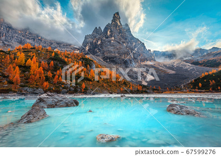 Autumn alpine landscape with turquoise glacier lake, Sorapis, Dolomites, Italy Autumn alpine landscape with turquoise glacier lake, Sorapis, Dolomites, Italy 67599276