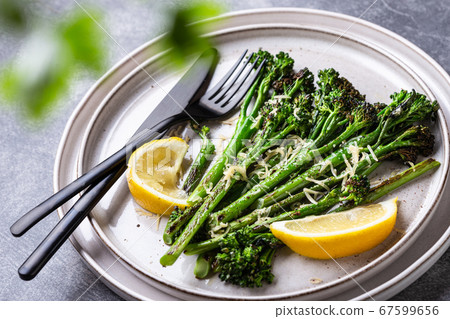 Roasted broccolini on the plate. Roasted broccolini on the plate. 67599656