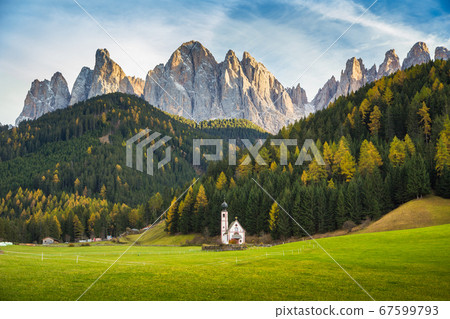 Church of St. Johann of Nepomuk with Odle Group in the Dolomites at sunset, Italy 67599793