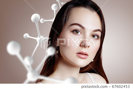 Beautiful woman near big white molecule chain. Beautiful woman near big white molecule chain. 67602453