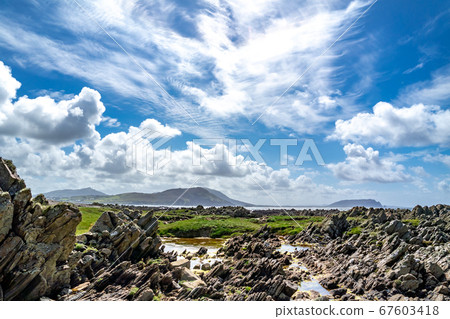 The beautiful coast next to Carrickabraghy Castle - Isle of Doagh, Inishowen, County Donegal - Ireland 67603418