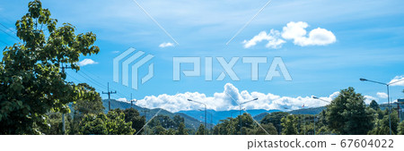Beautiful landscape white clouds blue sky mountain 67604022