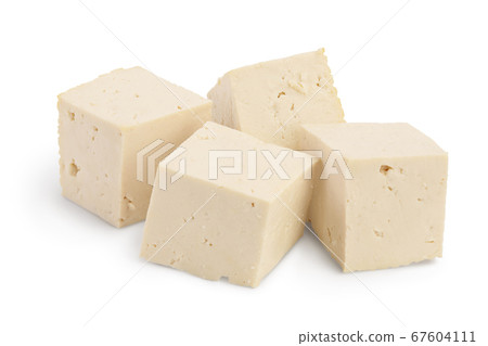 Heap of diced tofu cheese isolated on white background with clipping path and full depth of field, 67604111