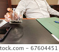 Interview with business man with empty glass 67604451