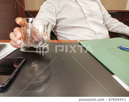 Interview with business man with empty glass Interview with business man with empty glass 67604451
