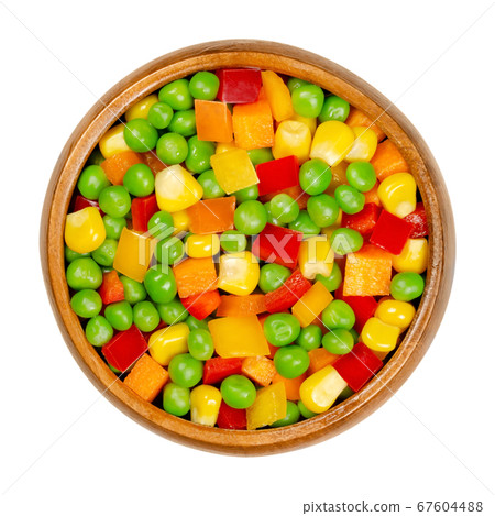 Mixed vegetables in a wooden bowl. Colorful veggie mix of green peas, corn, carrot cubes and diced bell peppers.  Organic and vegan. Closeup, from above, on white background, isolated macro food photo 67604488