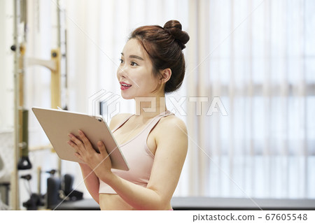 Young woman,exercise,pilates,sport Young woman,exercise,pilates,sport 67605548