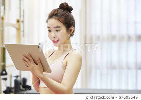 Young woman,exercise,pilates,sport 67605549