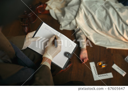 Male detective with cigar writes in notebook Male detective with cigar writes in notebook 67605647