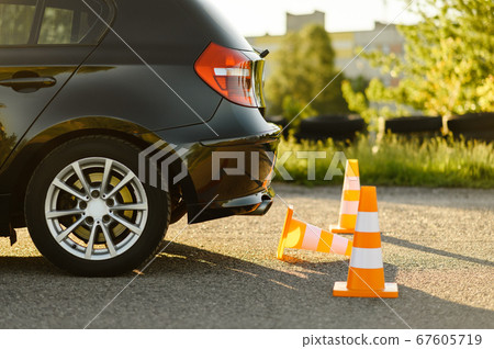 Car and traffic cones, driving school concept Car and traffic cones, driving school concept 67605719