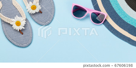 Beach flip flops with flowers and sunglasses 67606198