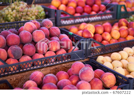 Fruit bazaar peaches grapes apricots ripe juicy 67607222