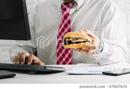 Working men do not have time to urgent eating junk Working men do not have time to urgent eating junk 67607614