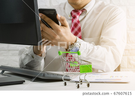 Business people check E-Commerce Online market and 67607615