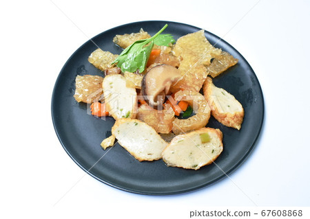 fried pork skin with slice fish line and carrot on plate 67608868