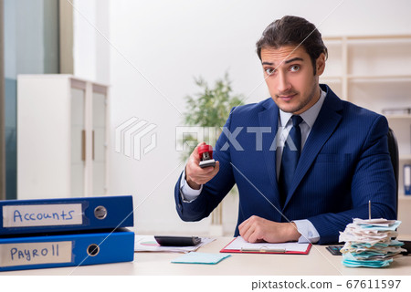 Young male financial manager in the office Young male financial manager in the office 67611597