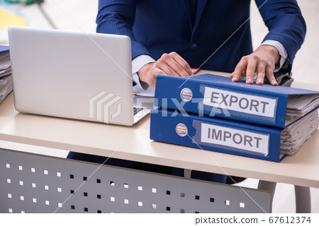 Young male logistics specialist working in the office 67612374