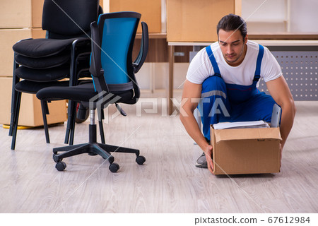 Young male professional mover doing home relocation Young male professional mover doing home relocation 67612984