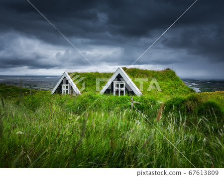 Old historic houses on the field in Iceland. Natural icelandic background. Travelling on Iceland. Old historic houses on the field in Iceland. Natural icelandic background. Travelling on Iceland. 67613809