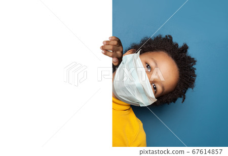 Black child boy in medical protective face mask 67614857