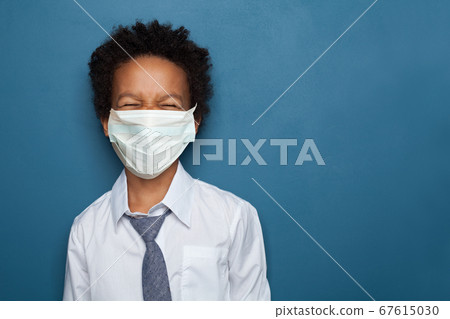 Black child boy in medical protective face mask 67615030