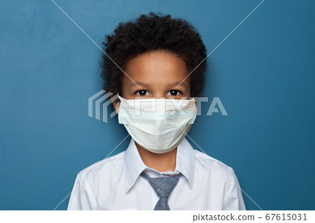 Black child boy student in medical protective face 67615031