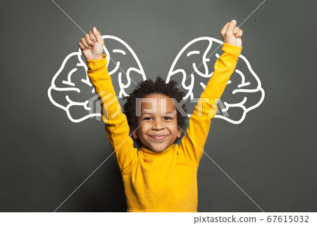Happy smart black child student boy with big brain 67615032