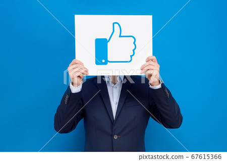Businessman covers his face with white board Businessman covers his face with white board 67615366