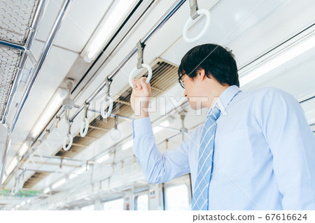 A man riding a train A man riding a train 67616624