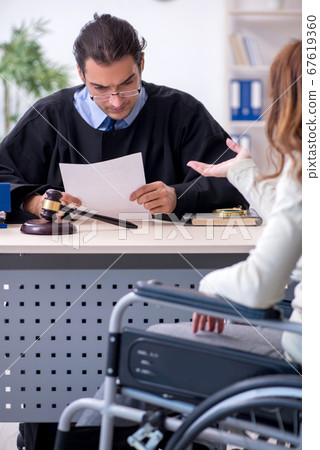 Injured woman and male judge in the courtroom Injured woman and male judge in the courtroom 67619360