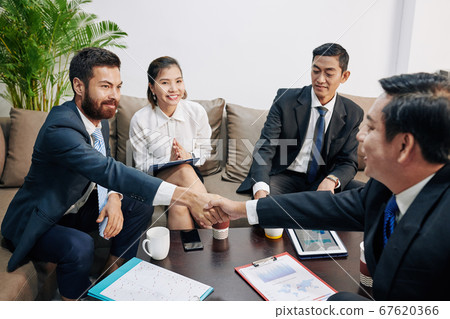 Business partners shaking hands 67620366