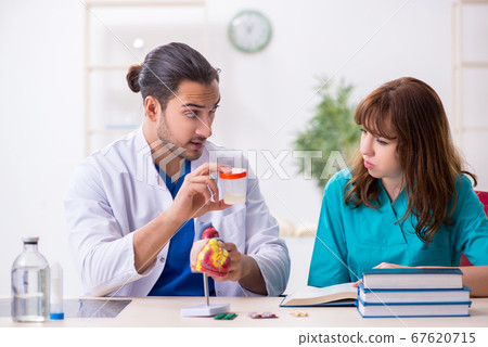 Two doctors colleagues working in the hospital 67620715