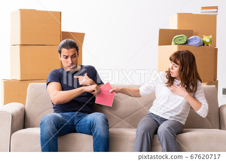 Young pair and many boxes in divorce settlement concept Young pair and many boxes in divorce settlement concept 67620717