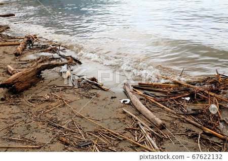 Garbage washed ashore on the beach after heavy rain Garbage washed ashore on the beach after heavy rain 67622132