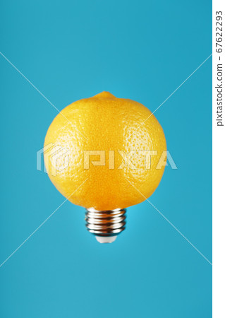 Light bulb lemon in flight on a blue background. 67622293