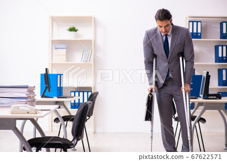 Leg injured employee in the office Leg injured employee in the office 67622571