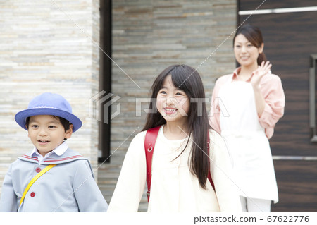 Mother seeing off with her child going to school Mother seeing off with her child going to school 67622776