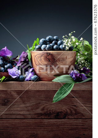 Summer still life with blueberries, colored sweet Summer still life with blueberries, colored sweet 67623376