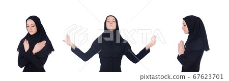 Young muslim woman praying isolated on white Young muslim woman praying isolated on white 67623701